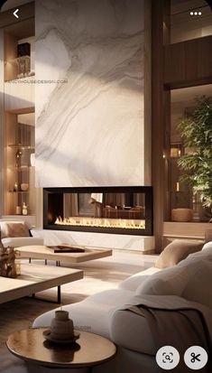 a living room filled with furniture and a fire place in the middle of it's wall