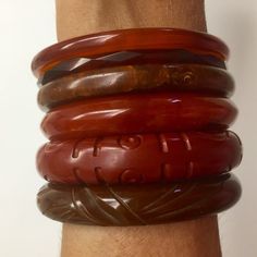 This bangle is a marbled  reddish brown. It is 1/2" wide. PHOTO 1There are 19 bangles for sale as a lot, set by color, or individually. Discounted if you buy set or lot. Lot price: $1,500, $1857 a la carte total!That's 20% off! PHOTO 4Reddish brown set of 6: $400.00(Compare to total reddish brown set prices a la carte: $469.00)SEE PHOTO 2-3Contact me if you want set/group/lot to adjust price/shippingOther sets/individual listings available from this lot:YELLOWSYellow cuff: 1 1/4" wide, 2 1/2" ac Handmade Brown Round Bangle, Brown Carved Bangle Bracelets, Brown Carved Bangle Jewelry, Carved Brown Bangle Jewelry, Adjustable Round Brown Bangle, Adjustable Brown Round Bangle, Brown Adjustable Bangle, Adjustable Brown Vintage Bangle, Vintage Brown Bangle As A Gift