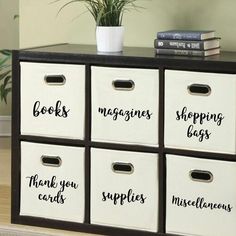 the drawers are labeled with books, magazines, and other things in black lettering on them