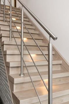 a set of stairs with lights on each handrail