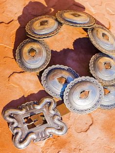 Geraldine Yazzie is a Navajo silversmith in her early 50's who has been smithing silver for nearly thirty years. She lives near Crownpoint, New Mexico and is known for her Traditional Revival style jewelry. She is also particularly adept in her manner of oxidizing her silver so that the patina seems to be due simply to age of the piece. In addition, she pays particular attention to using stamps of a bygone era and sometimes adds small nicks to her pieces to make them look as though they've been Luxury Concho Jewelry For Rodeo, Vintage Concho Jewelry For Ranch, Vintage Sterling Silver Jewelry For Festivals, Southwestern Hand-tooled Jewelry For Ranch, Vintage Antique Silver Jewelry For Festivals, Antique Silver Vintage Jewelry For Festivals, Vintage Hand-tooled Jewelry For Western-themed Events, Vintage Hand Tooled Jewelry For Western-themed Events, Southwestern Style Oxidized Round Jewelry