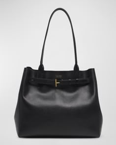 TOM FORD "Audrey" tote bag in grain leather, polyester, and brass     Shoulder strap     Open top with adjustable Tcenter strap     Interior, one zip pocket     Lining: Polyester    Approx. 11"H x 13"W x 7.1"D    Item Weight (Lbs.): 1.5    Made in Italy Designer Work Bag, Work Bags For Women, Tom Ford Bag, Luxury Tote Bags, Trendy Purses, My Style Bags, Medium Tote Bag, Work Tote Bag, Best Purses