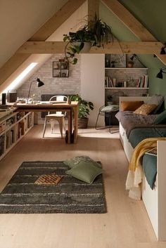 an attic bedroom with wooden floors and green walls