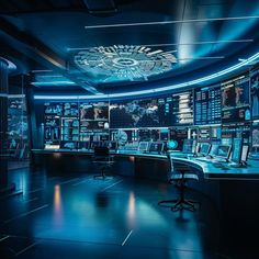 the control room is lit up with blue lights and displays on the wall behind it