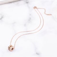 Add an instant splash of glam to your everyday ensembles wearing this geometric piece cast in gleaming 18k rose gold-plated metal. Chain: 15.8'' L with 2'' extender Pendant: 0.43'' W x 0.43'' H Lobster claw clasp 18k rose gold-plated titanium steel / cubic zirconia Square Pendant Necklace, Square Pendant, Metal Chain, 18k Rose Gold, Lobster Claw, Rose Gold Plates, Cubic Zirconia, Gold Necklace, Gold Plate