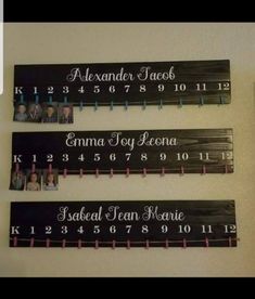 three personalized wooden signs hanging on the wall with name and date in each one