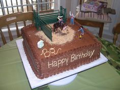 a birthday cake that is shaped like a rodeo scene with horses and people on it