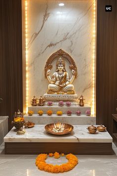 there is a buddha statue in the middle of a room with candles and flowers around it