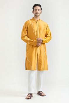 Mustard chanderi kurta with placed abstract pattern embroidery. Comes with contrasting pyjama. - Aza Fashions Designer Sets With Gota Work For Eid, Designer Gota Work Kurta For Eid, Designer Gota Work Kurta For Diwali, Designer Cotton Kurta With Zari Work, Designer Cotton Kurta For Eid, Designer Cotton Traditional Wear For Diwali, Designer Cotton Straight Kurta, Designer Cotton Kurta For Diwali, Kurta Set Men