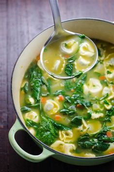 tortellini soup with spinach in a pot