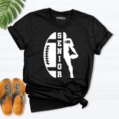 senior football shirt, football team number shirt,custom football shirt, football senior night gift, football player fan shirt, Football tee, That's My Senior Football shirt, Football senior night Shirt, 2025 Senior football Shirt, Senior football mom dad shirt, football team shirt Show your pride with our exclusive Football Mom shirts, perfect for cheering on your favorite team! Whether you're looking for a classic football shirt or a special senior night shirt, we have something for every passionate fan. Celebrate your senior football player with a custom football tee that highlights their number, making it a thoughtful gift for senior night. Our collection also includes stylish options for the entire football team, ensuring everyone can represent their spirit on game day. Elevate your f Varsity T-shirt For Football Season Team Events, Custom Print T-shirt For Football Season Team Events, Collegiate Customizable T-shirt For Football Season, Collegiate T-shirt With Custom Print For Football Season, Collegiate Custom Print T-shirt For Football Season, School Spirit T-shirt With Custom Print For Football Season, Football Season Sports Fan T-shirt With Custom Print, Custom Print T-shirt For Football Season, Football Season Fan Apparel T-shirt With Custom Print