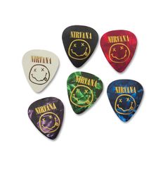 six guitar picks with different designs on them