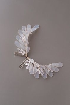 Bridal hair piece, Feather wedding hair piece, Veil hair piece, Side hair comb, Bride hair comb, Wedding hair comb silver, Bridal veil comb Our pretty and elegant angel hair pieces are perfect choice for a modern bride. The hair pieces are made of UV resin, that is the new trend in handmade jewelry. Each petal is created manually. The comb is finished with white Czech beads, Cubic zirconia rhinestones with silver rhodium plated wire to enhance its design and shape  You can purchase one or two hairpieces! - Available in gold/rose gold and silver-tone. - The color and size of flowers we can make according to your preferences. - Suits a range of hairstyles - Measurements approx.: 4.33 inches (11 cm) - Comes in a beautiful signature box! Custom orders are welcome! Feel free to contact us!! Ple Unique Bridal Hair Comb, Veil Hair Piece, Bride Hair Comb, Feather Hair Pieces, Veil Hair, Veil Comb, Comb Veil, Flower Hair Accessories Wedding, Wedding Hairpiece