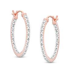 A modern must-have, these diamond hoop earrings bring the sparkle to any attire. Crafted in sterling silver with 10K rose gold plate, each 21.0mm hoop shimmers with diamonds along the outside front and inside back edge. Radiant with 1/4 ct. t.w. of diamonds and a brilliant buffed luster, these earrings secure with latch backs. Rose Gold Plate, Peoples Jewellers, Diamond Hoop Earrings, Diamond Stone, Earring Backs, Gold Plated Sterling Silver, Sterling Earrings, Designer Earrings, Rose Gold Plates