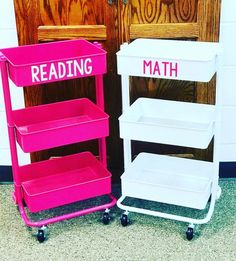 two pink and white bookshelves sitting next to each other