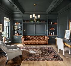 a living room filled with furniture and a rug