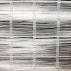 a close up view of the side of a white wall with vertical lines on it