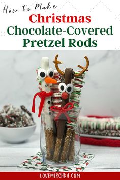 A decorative, glass vase filled with various Christmas Pretzel Rods, including a milk chocolate dipped pretzel rod that looks like a reindeer (with golden pretzel antlers and a round, bright red, m&m nose) and a white chocolate covered pretzel rod that looks like a snowman with a bright orange candy nose and bright red, licorice scarf tied around his neck. Christmas Pretzel Rods, Pretzel Rods Recipe, Chocolate Covered Pretzels Christmas, Christmas Pretzel, Holiday Pretzels, Christmas Pretzels