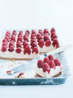 there is a piece of cake with raspberries on it