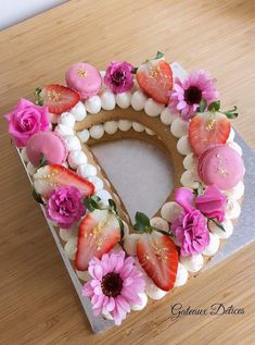 a cake decorated with strawberries and flowers