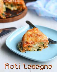 a piece of lasagna sitting on top of a blue plate with a fork