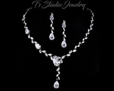 "CZ Cubic Zirconia Bridal Necklace and Earrings Wedding Jewelry Set - Pear and Marquise shaped stones Available with white or ivory pearls, or teardrop CZ cubic zirconia drops. This beautiful bridal jewelry set includes cubic zirconia necklace and earrings with a mixture of pear and marquise shaped CZ crystal stones. Necklace measures 16'' with a 2\" extender chain.  Earrings measure 2'' Matching bracelet sold separately. Please contact me if you would like a pearl color other than white or ivor Wedding Jewelry And Accessories, Beautiful Bridal Jewelry, Studio Jewelry, Wedding Jewelry Set, Stones Necklace, Bridal Jewelry Set, Zirconia Necklace, Cubic Zirconia Necklace, Wedding Accessories Jewelry