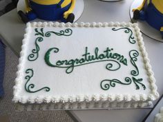 there is a cake that says congratulations on it