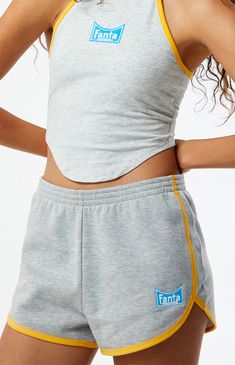 PacSun exclusive! Get ready to chill in style with the Fanta x PacSun Mini Sweat Shorts. These mid-rise shorts feature contrast binding and a curved hem for a sporty yet trendy look. Complete with Fanta embroidery and an elastic waistband, they offer a comfortable and effortless fit for casual days or lounging around.


	Solid color shorts
	Soft fleece lining
	10.75" rise
	2" inseam
	24.5" leg opening
	Mid-rise
	Elastic waistband
	Contrast binding
	Curved hen
	Fanta embroidery
	60% cotton, 40% polyester
	Machine washable
	Model is wearing a size small
	Model measurements: 5’6” height, 30” bust, 25.5” waist, 36.5” hip Mid Rise Shorts, Sweat Shorts, Indie Brands, Color Shorts, Pant Shirt, Skirted Swimwear, Short Rompers, Basic Tees, Hoodie Dress