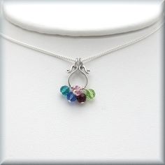 "A beautiful little u-shaped charm encircles birthstones representing children and/or grandchildren. This is the perfect size for moms who don't want or like a larger necklace but like the idea of holding her children close to her heart with a birthstone necklace. PLEASE NOTE: The birthstones will \"cluster\" more toward the middle (like grapes) since, with a circular shape, they tend to fall naturally toward the middle of the necklace. Sterling curb chain. The pendant measures about 1/2\" (1.27 Mother's Day Sterling Silver Birthstone Necklace For Birthday, Sterling Silver Birthstone Necklace For Mother's Day Birthday, Adjustable Sterling Silver Necklace For May Birthstone, Adjustable Sterling Silver May Birthstone Necklace, Sterling Silver Birthstone Necklace Gift For Mom Nickel-free, Handmade Sterling Silver Birthstone Necklace For Birthday, Nickel-free Sterling Silver Birthstone Necklace For Mom, Adjustable Sterling Silver Birthstone Charm Necklace, Adjustable Sterling Silver Birthstone Charm Necklaces