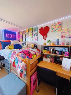 a bed room with a neatly made bed and desk