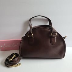 "Vtg Classic Coach Chadwick Satchel Brown leather with brass hardware Roomy interior with full size zip pocket, secured by a top zipper Missing Hang tag and chain Removable 40\" thin strap Strap drop: 6\" Measures: 11\"L, 9\"H, 4\"W Made in the United States #A5D-9923 Flaw: stains on inside that did not remove with cleaning Cleaned, conditioned and ready to wear! Questions? Just ask More vtg Coach colors/styles also available G82" Brown Coach Handheld Bag, Coach Brown Bag With Adjustable Strap, Retro Coach Brown Bag, Coach Brown Bags For On-the-go, Brown Coach Bag With Turn-lock Closure, Vintage Coach, Top Handle Bags, Givency Antigona Bag, Simple Chic