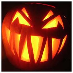 a carved pumpkin with an evil face on it