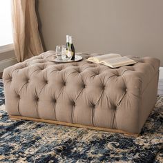 a coffee table that is on top of a rug