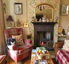 a living room filled with furniture and a fire place next to a wall mounted mirror