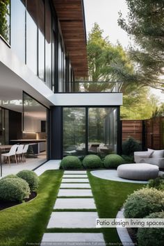 an outdoor living area with grass and plants