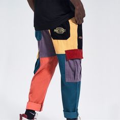 These Aelfric Eden "Back To 90's" Patchwork Color Block Corduroy Pants Are The Perfect Mix Of Funky And Functional. With A Retro Multi-Colored Patchwork Design Made Of Cozy Corduroy, You Can Wear Them All Day While Dancing, Skateboarding, Or Simply Living Your Best Life . Look Cool And Stay Comfyit's A Win-Win! The Main Components Include Knitted Fabrics With A Loose Fabric Structure, Soft Cotton Fabrics, And Lightweight Polypropylene. The Main Advantages Are High Activity, Multiple Storage, Eas Retro Winter Streetwear Bottoms, Cotton Hip Hop Jeans For Winter, Hip Hop Winter Cotton Jeans, Hip Hop Cotton Jeans For Winter, Baggy Red Cotton Jeans, Red Baggy Jeans With Pockets, 90s Baggy Cotton Jeans, Trendy Patchwork Pants, Trendy Streetwear Pants With Hip Pockets