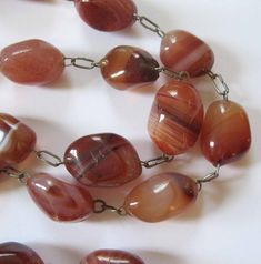 Brown Vintage Agate Necklace, Vintage Brown Agate Necklace, Vintage Agate Necklace With Natural Stones, Vintage Agate Oval Beaded Necklaces, Vintage Red Agate Necklace, Vintage Agate Necklaces With Polished Beads, Vintage Amber Agate Necklaces, Antique Amber Agate Necklace, Vintage Agate Gemstone Beaded Necklaces