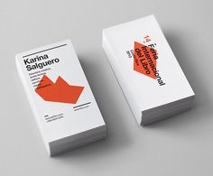 two business cards designed to look like an origami arrow with the words kanna saugeroo on them