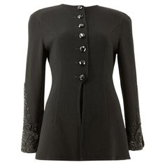 A late 1980’s Valentino Boutique black fine wool double-face crepe fitted jacket with a round neckline and style seams, the two-piece set-in sleeves featuring a cascading embroidered and beaded floral design with complementing three dimensional appliqué and slit, the grown-on front placket with an elongated reverse V opening, finished with a set of hexagonal black faceted buttons. This item carries the Valentino Boutique authenticity label. Vintage designer jackets sourced by Stelios Hawa with t S Valentino, Designer Jackets, Fitted Jacket, Restoration Services, Beaded Cuff, Vintage Designer, Jacket Design, Workout Jacket, Double Face