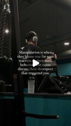 a man wearing headphones sitting in front of a mirror with the caption, manhattan is when they blime you for your reaction