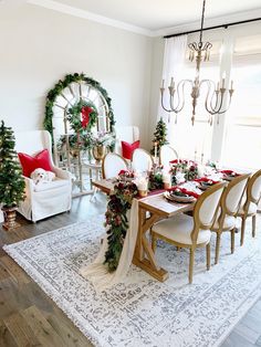 a dining room table with christmas decorations on it