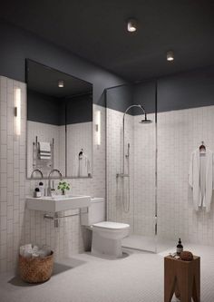 a bathroom with white tile walls and flooring