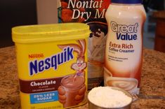 ingredients to make chocolate ice cream sitting on a counter top, including milk and powder