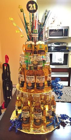 a cake made out of beer bottles on top of a table