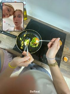 a woman cooking food on top of a stove