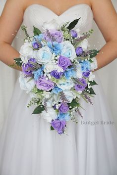 a bridal holding a bouquet of blue and white flowers