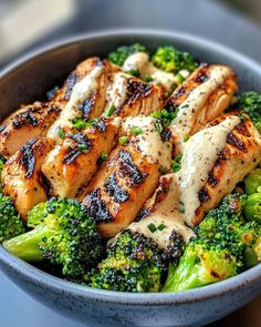 chicken and broccoli in a bowl on a table