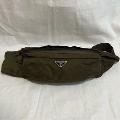 Price Is Final - Will Not Go Any Lower Prada Nylon Belt Bag Color: Dark Green In Great Condition - Pre Loved, Minimal Signs Of Use, Overall Clean Interior/Exterior Surface Scratches On Metal Buckle Zippers Work Smoothly Measurements (Approx): 13"L X 5"H || Total Length From One Buckle To The Other 53in. Made In Italy No Dust Bag No Trades Nylon Belt Bag, Prada Nylon, Prada Bag, Metal Buckles, Belt Bag, Interior Exterior, Dark Green, Prada, Dust Bag