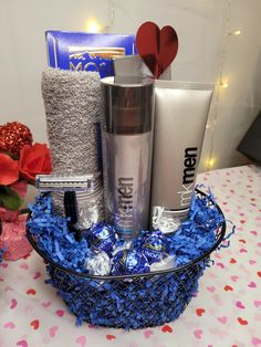 a basket filled with personal care items on top of a table covered in confetti