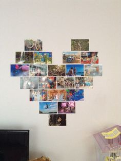 a heart shaped photo collage hanging on the wall